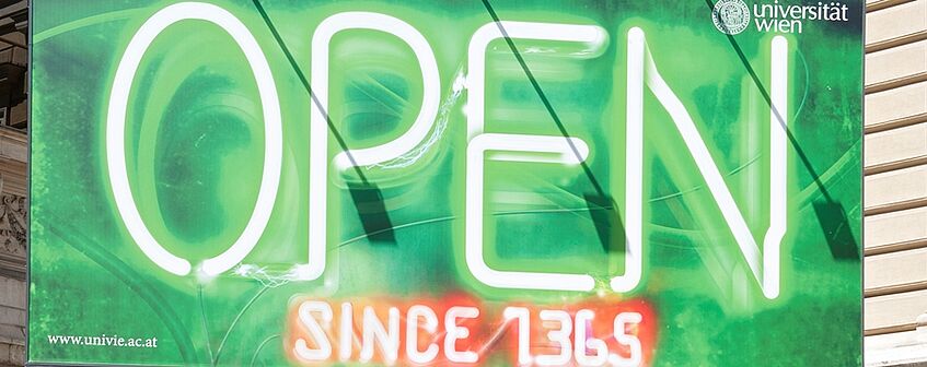 a green poster with green and red text saying 